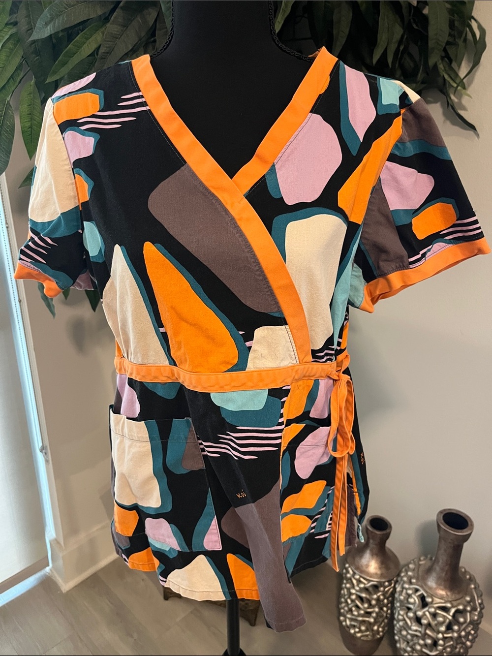 Koi Abstract Wrap scrub Top in Orange, Black & Teal